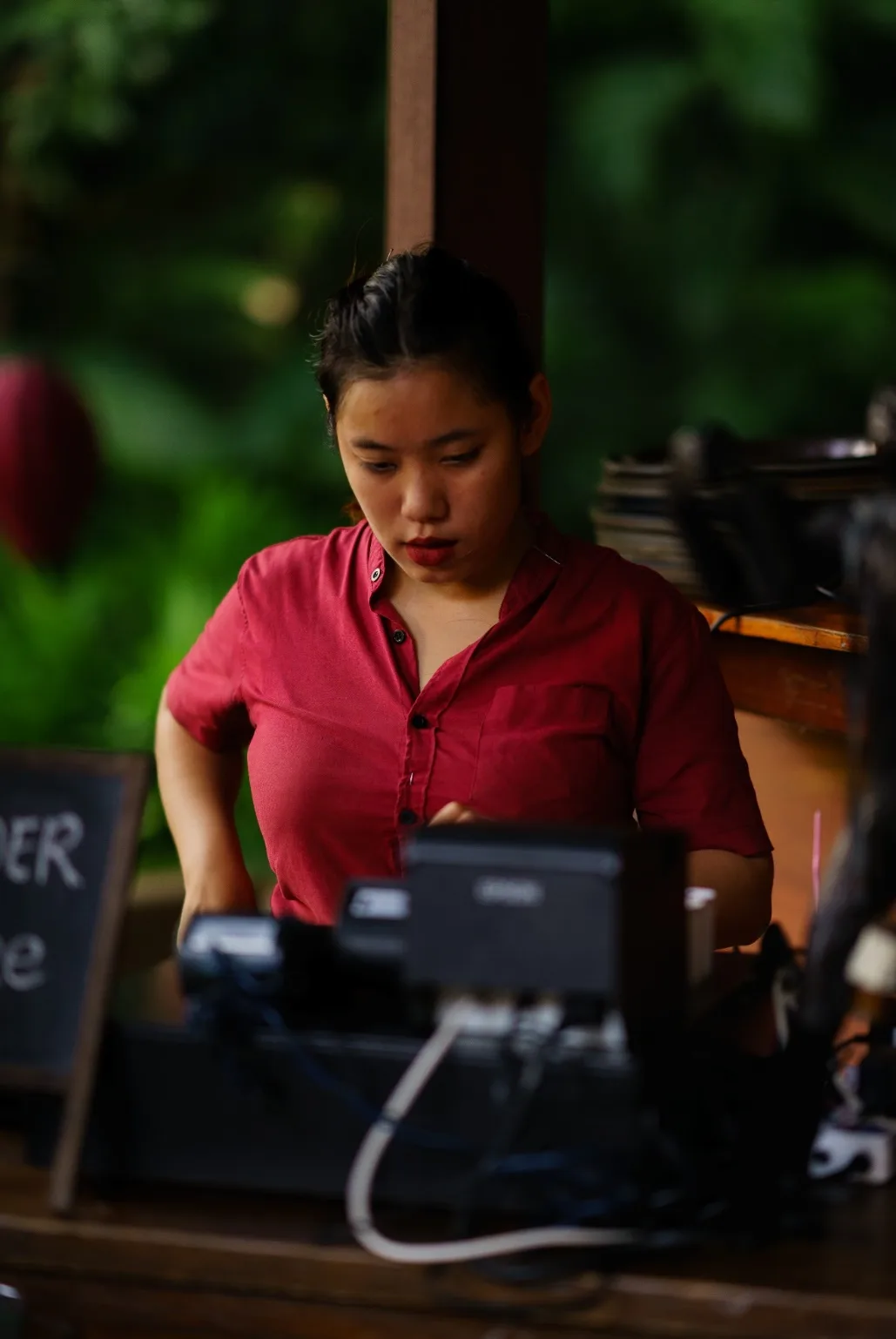 A MonkeyPod team member works at the event register.