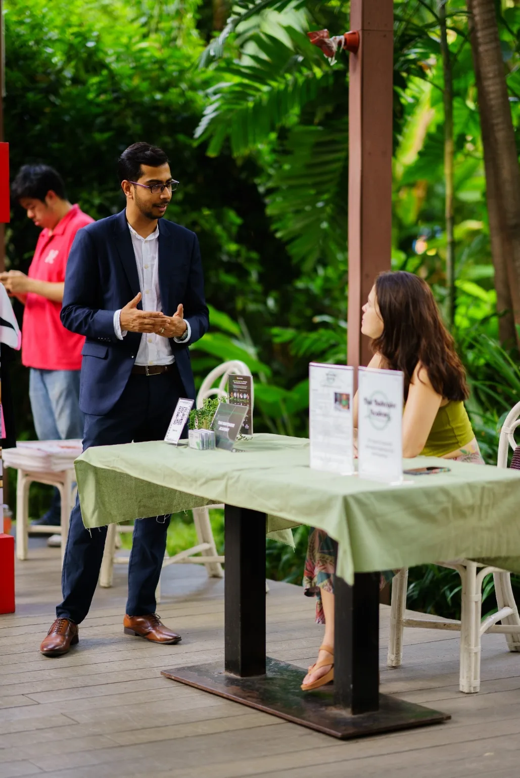 The Budtender Academy booth hosts a conversation in the garden.