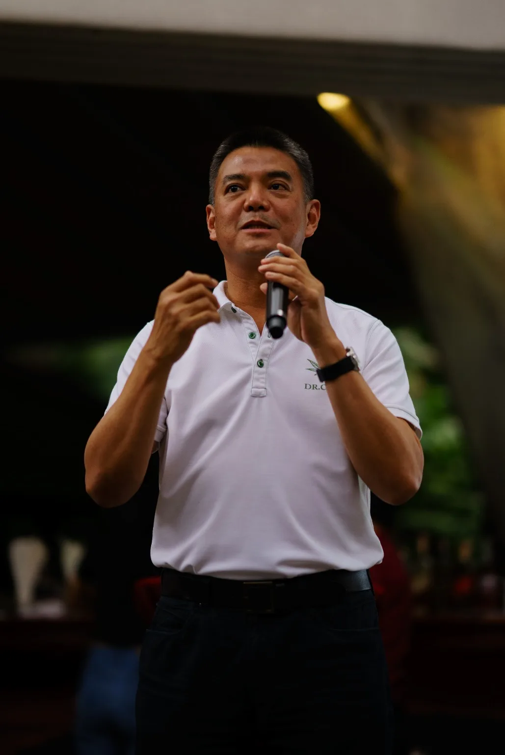 Pornchai Padmindra speaks into a microphone during the CBD workshop.
