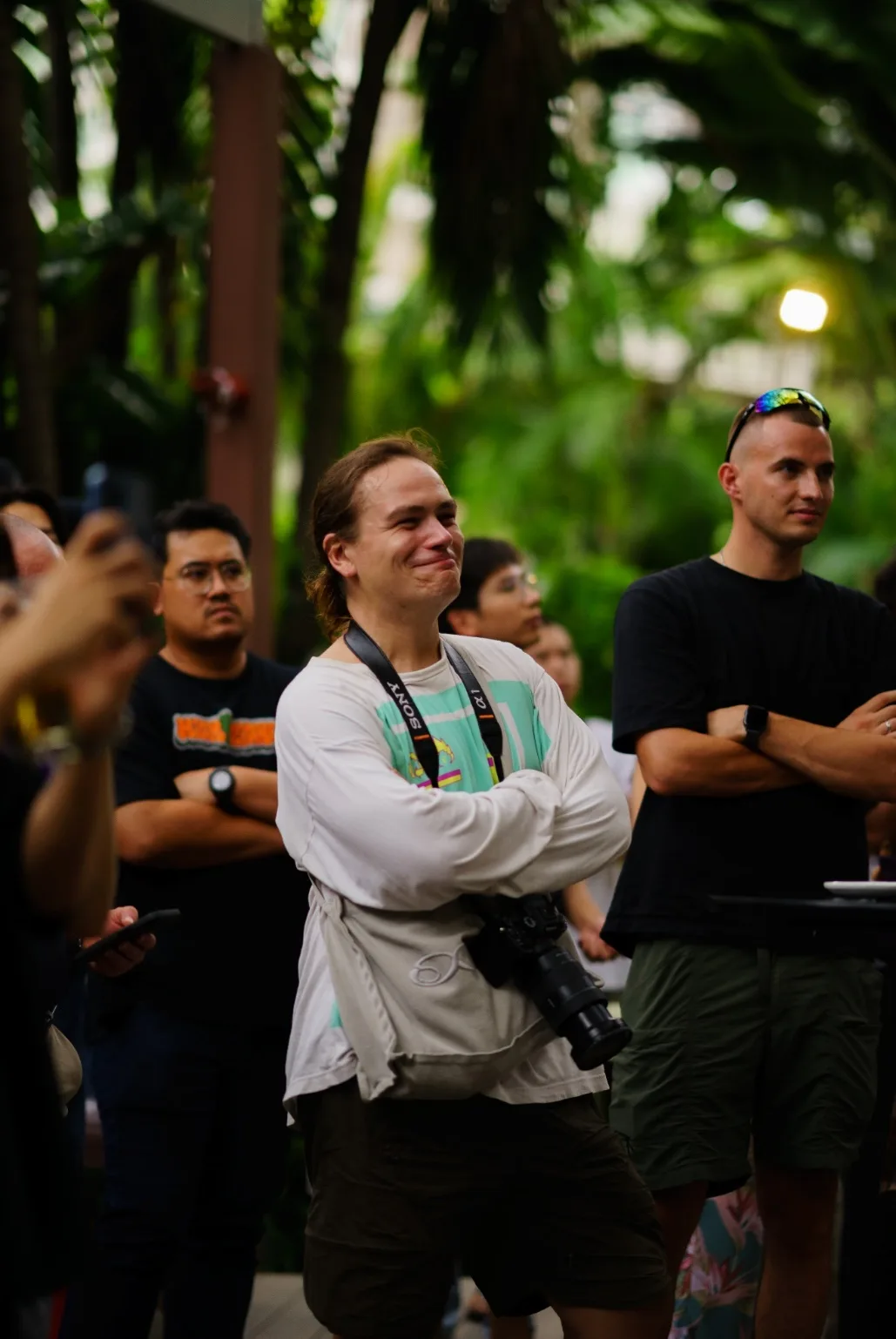 Attendees smile while listening to the workshop.