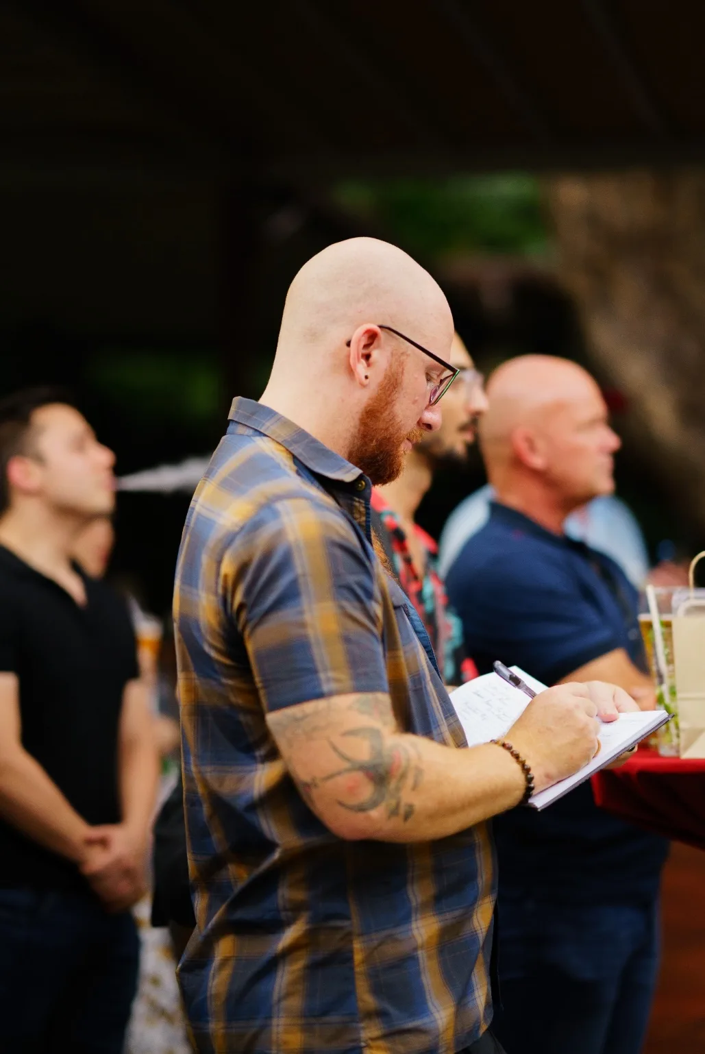 An attendee writes notes during the workshop.