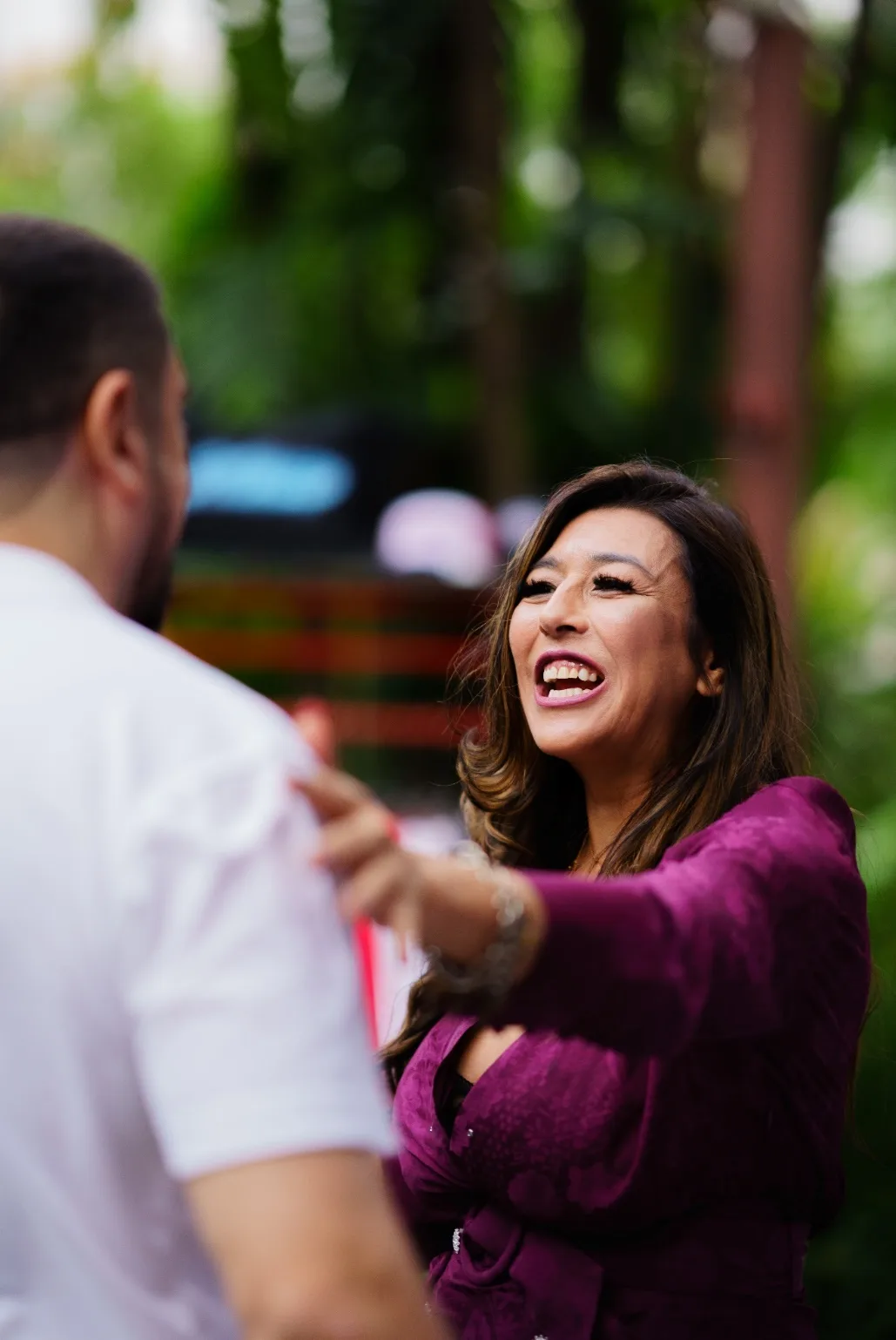 Monica Garcia smiles while speaking with an attendee before the panel.