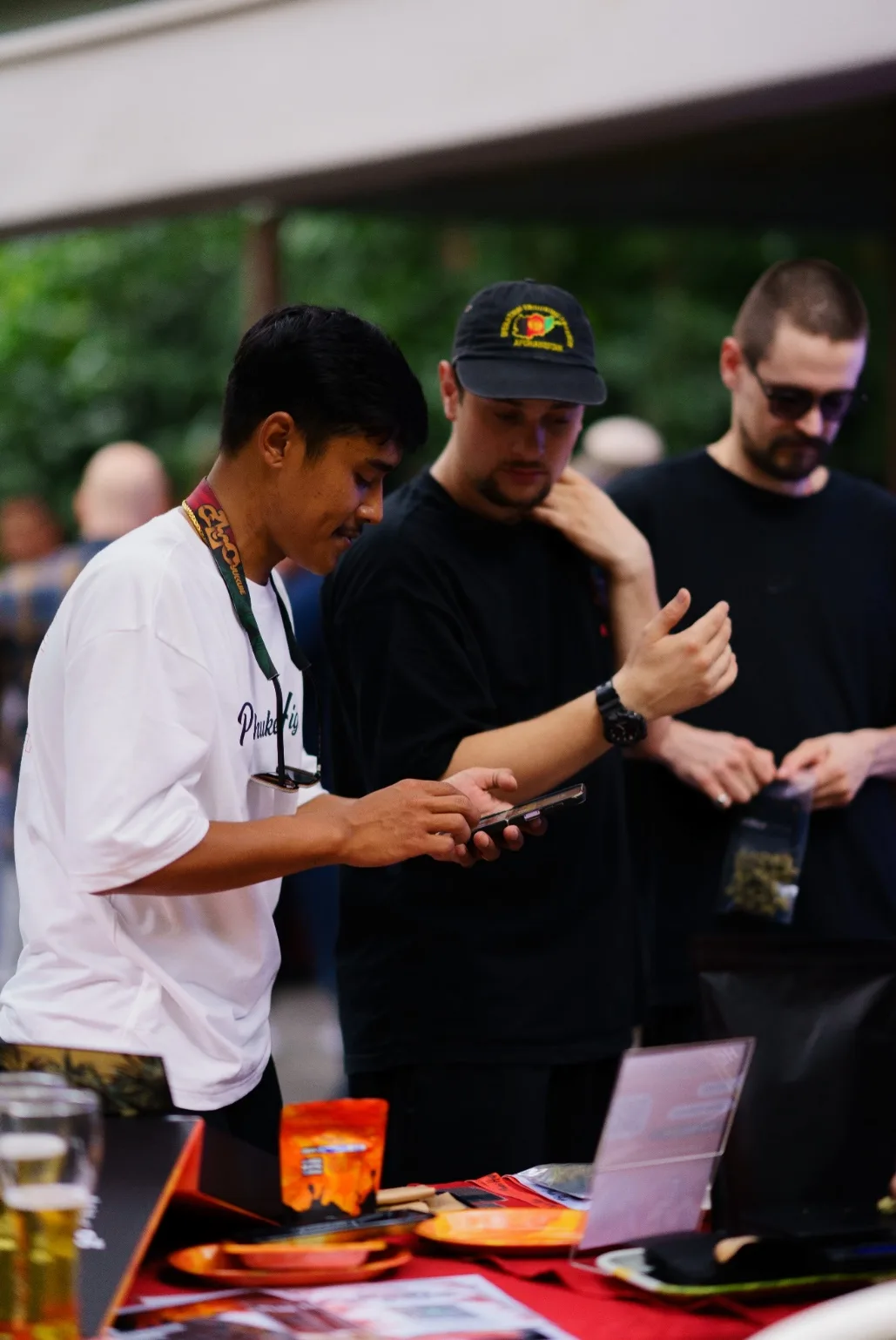 Attendees examine products at a sponsor booth.