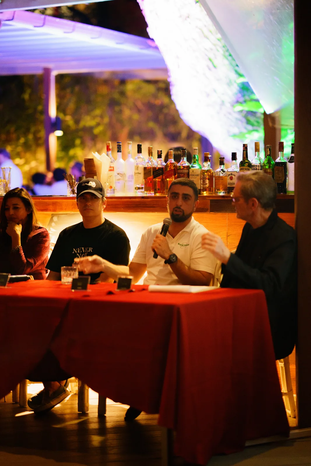Gaurav Sehgal sits with fellow panelists during the evening discussion.